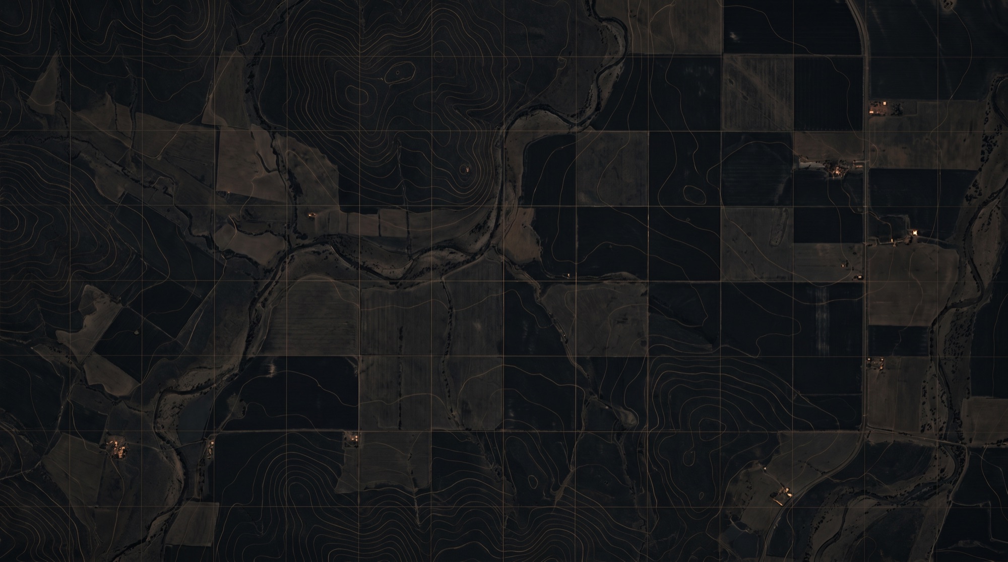Aerial view of a farm showing paddocks, fence lines and waterways